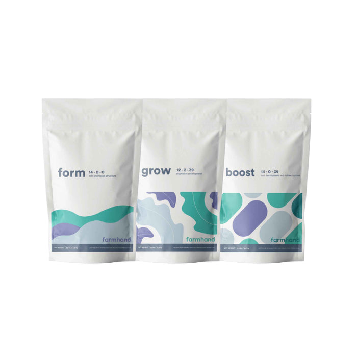Farmhand fom, grow and boost 5lb bags, lined up in a row against a white background